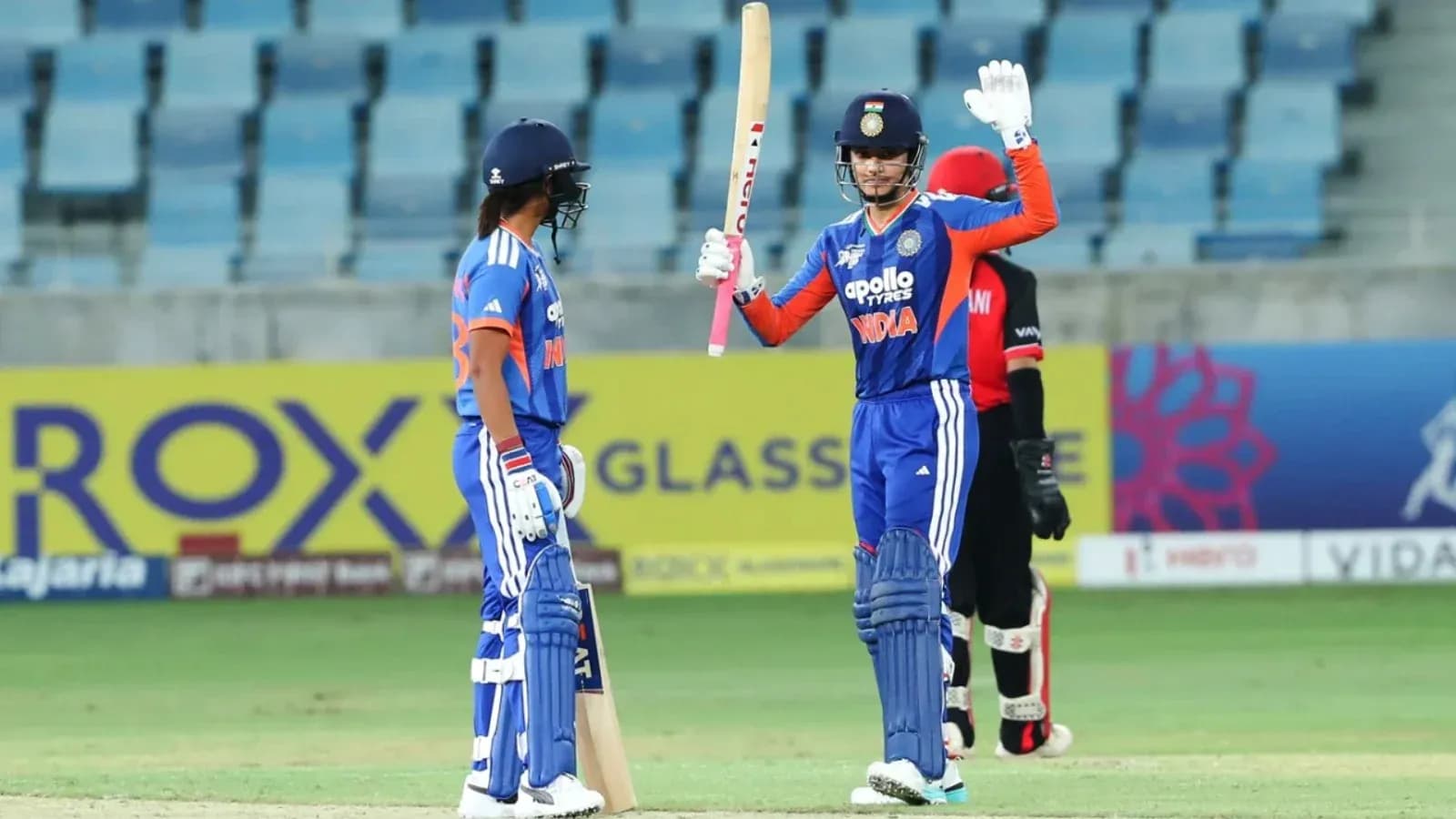 Batsman celebrating after scoring runs in cricket match Batsman celebrating after scoring runs in cricket match