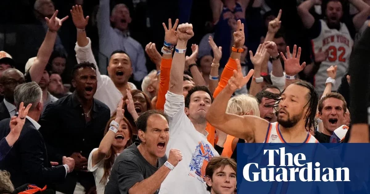 Fans celebrating enthusiastically at a basketball game Fans celebrating enthusiastically at a basketball game