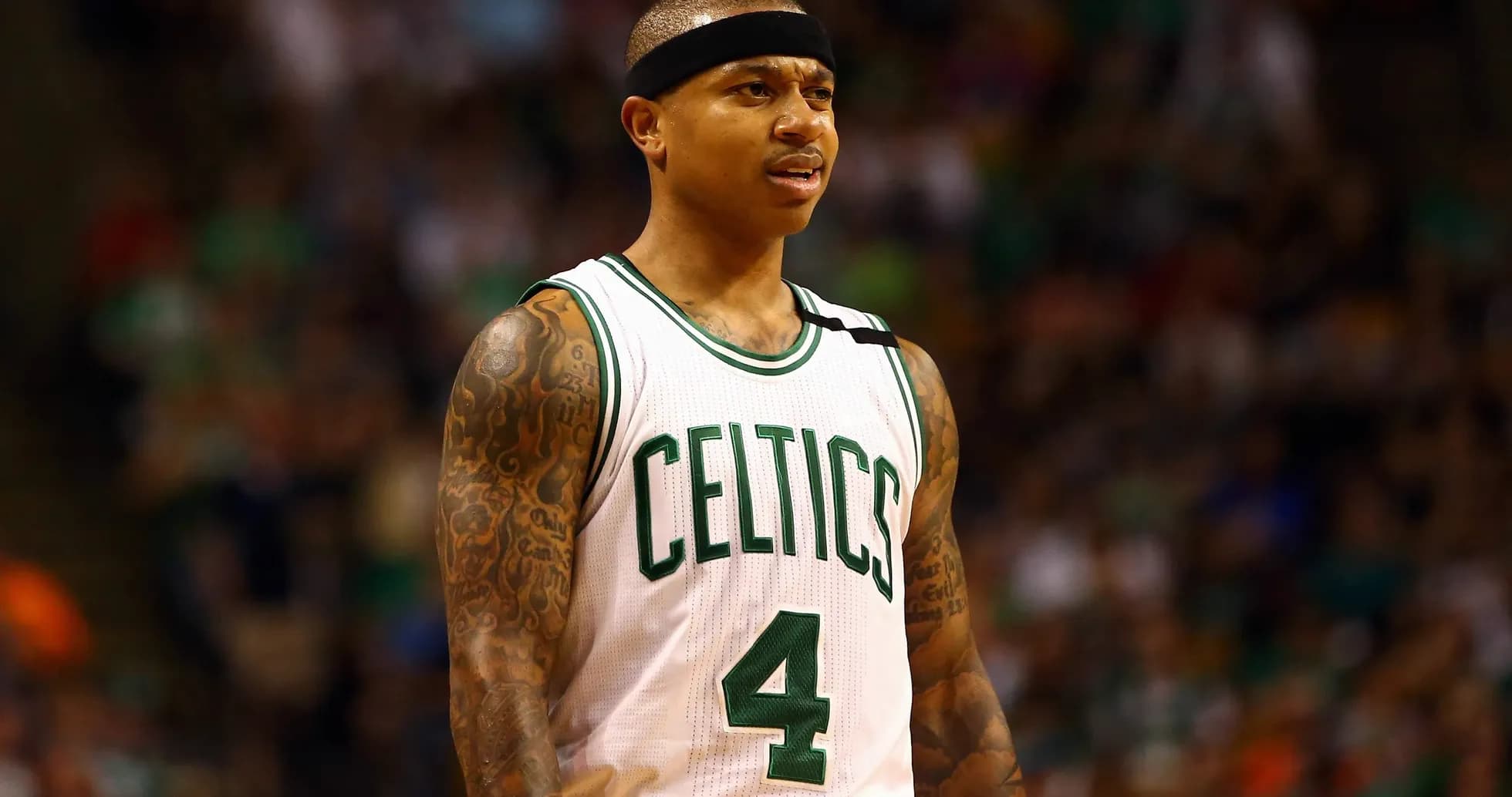 Player in Celtics jersey during basketball game Player in Celtics jersey during basketball game