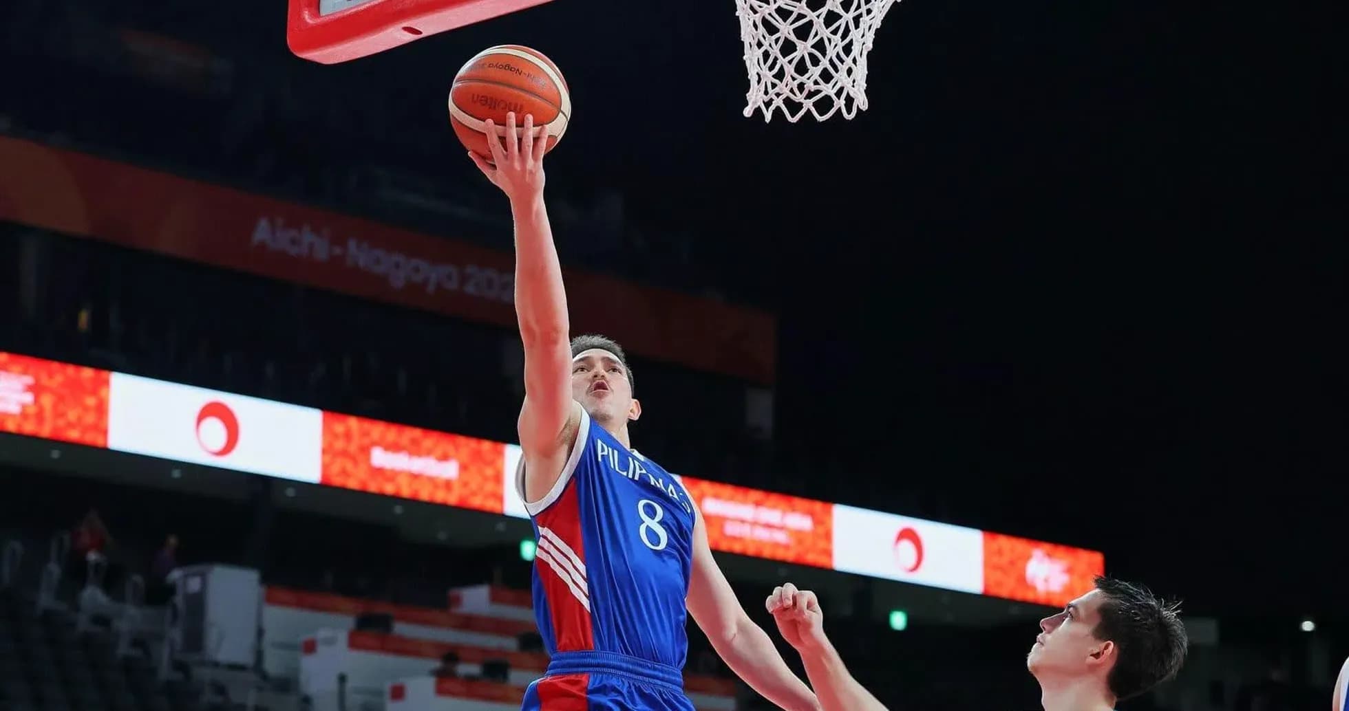Player shooting a layup during basketball game Player shooting a layup during basketball game
