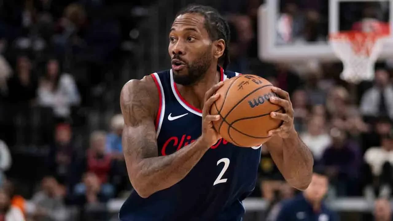 Player dribbling basketball during game action Player dribbling basketball during game action