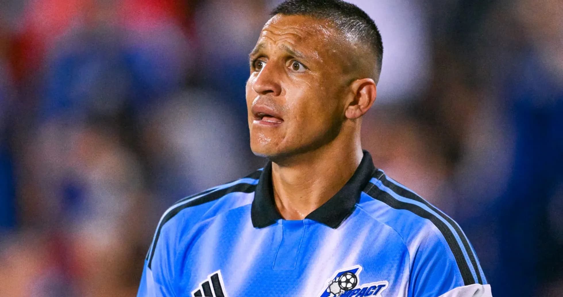 Soccer player in blue jersey during match Soccer player in blue jersey during match