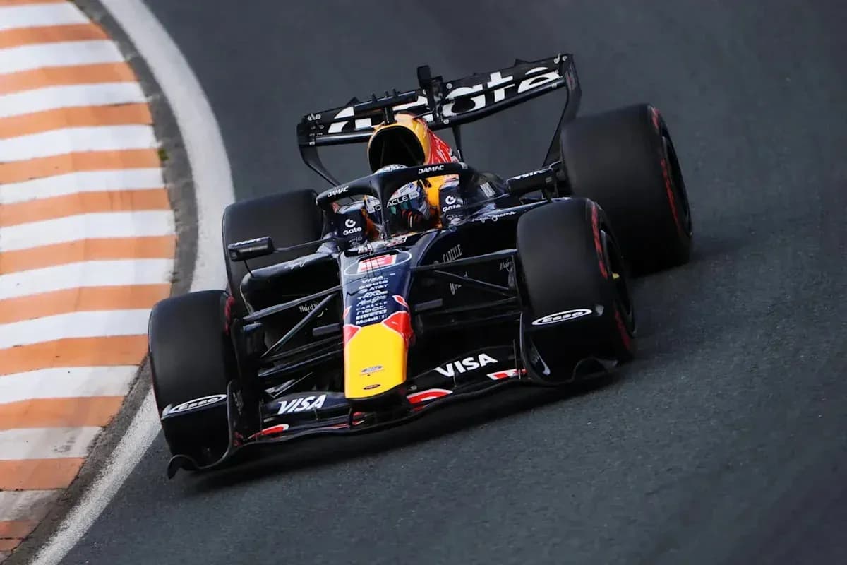 Formula 1 car racing around a curved track Formula 1 car racing around a curved track