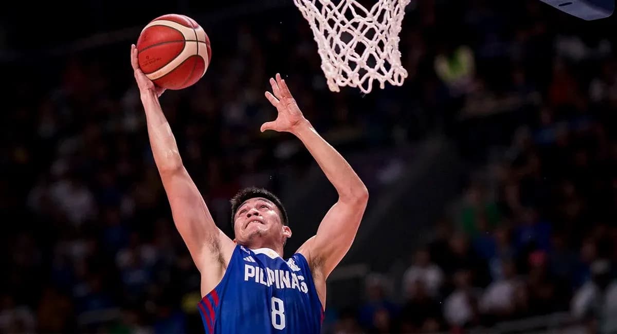 Player shooting a basketball during a game Player shooting a basketball during a game