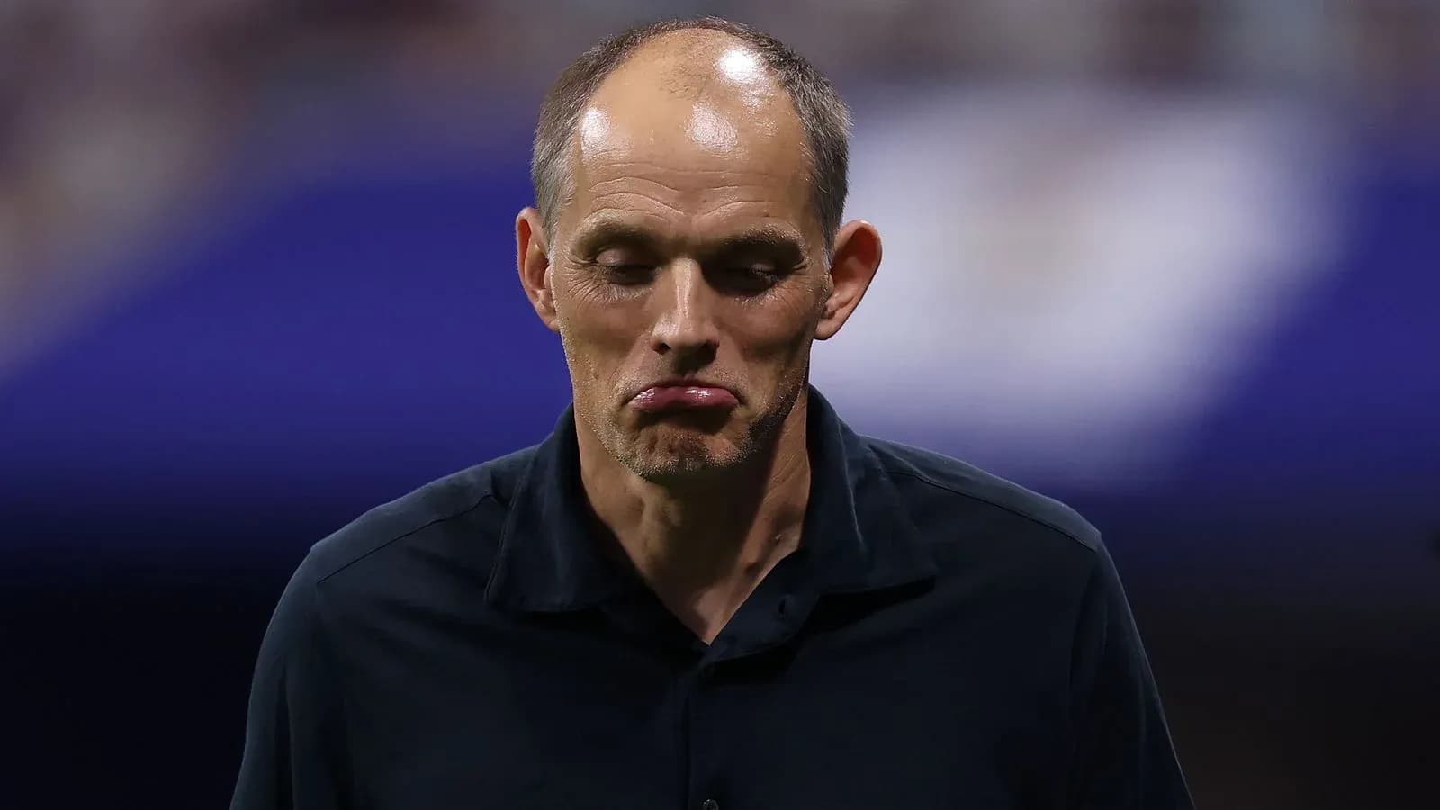 Coach walking off with a concerned expression Coach walking off with a concerned expression