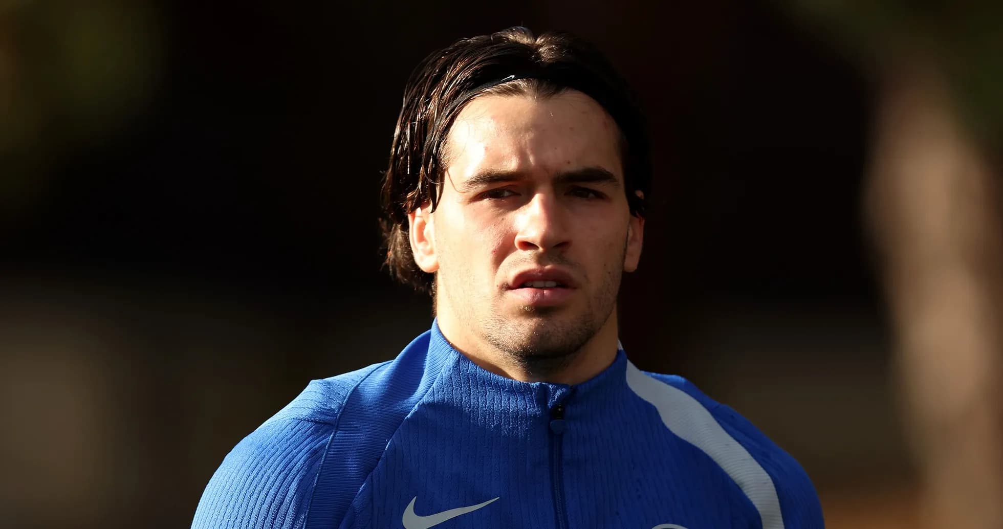 Player in blue training kit during session Player in blue training kit during session