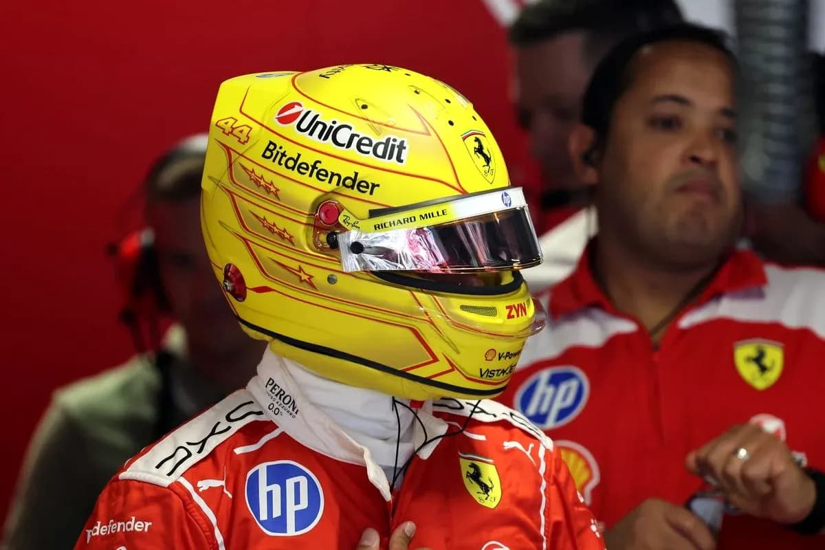 Driver in Ferrari suit preparing for race Driver in Ferrari suit preparing for race