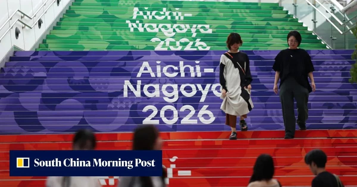 Two women walking down colorful steps labeled Aichi-Nagoya 2026 Two women walking down colorful steps labeled Aichi-Nagoya 2026