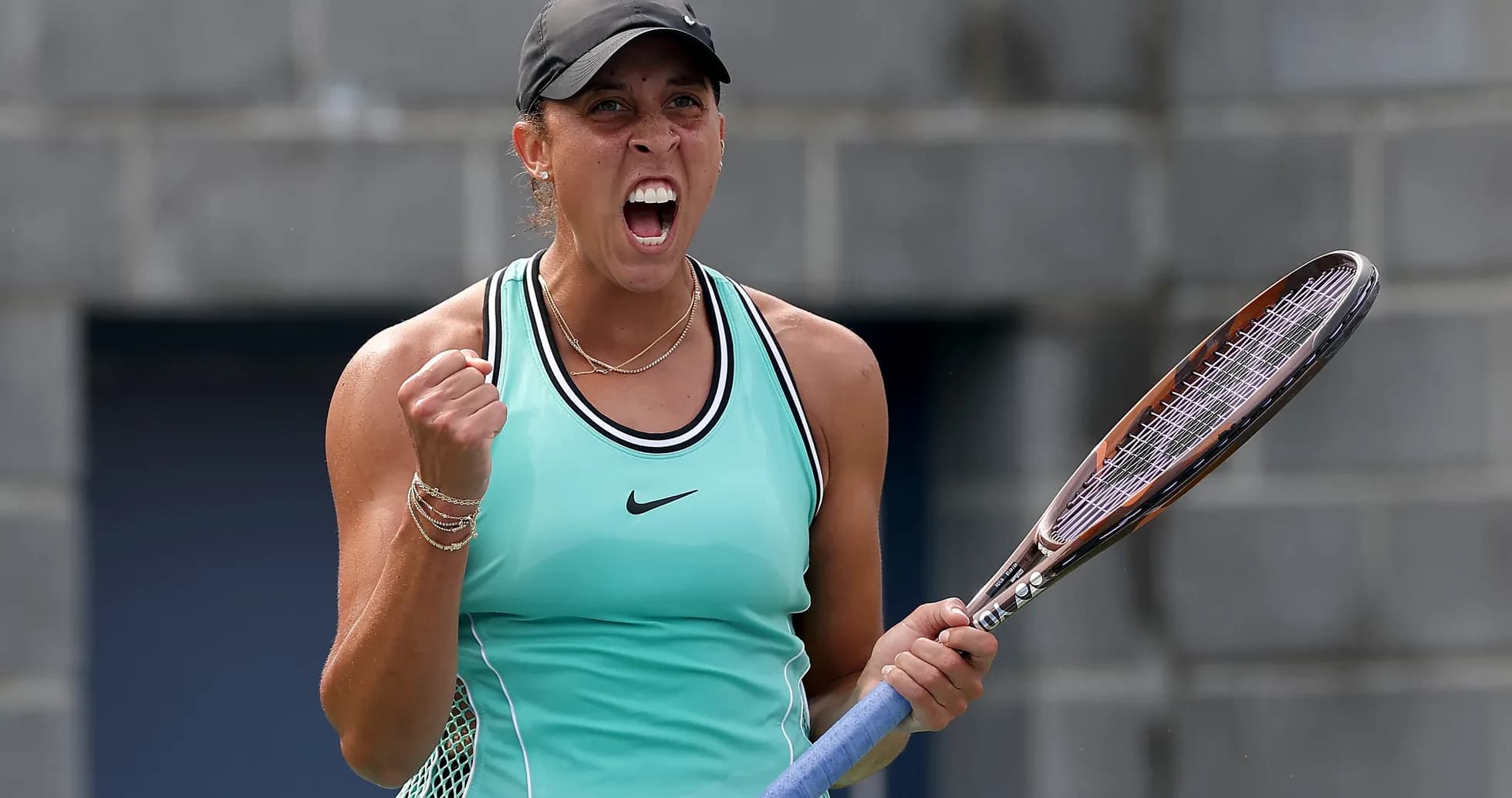 Tennis player celebrating with racket after winning point Tennis player celebrating with racket after winning point