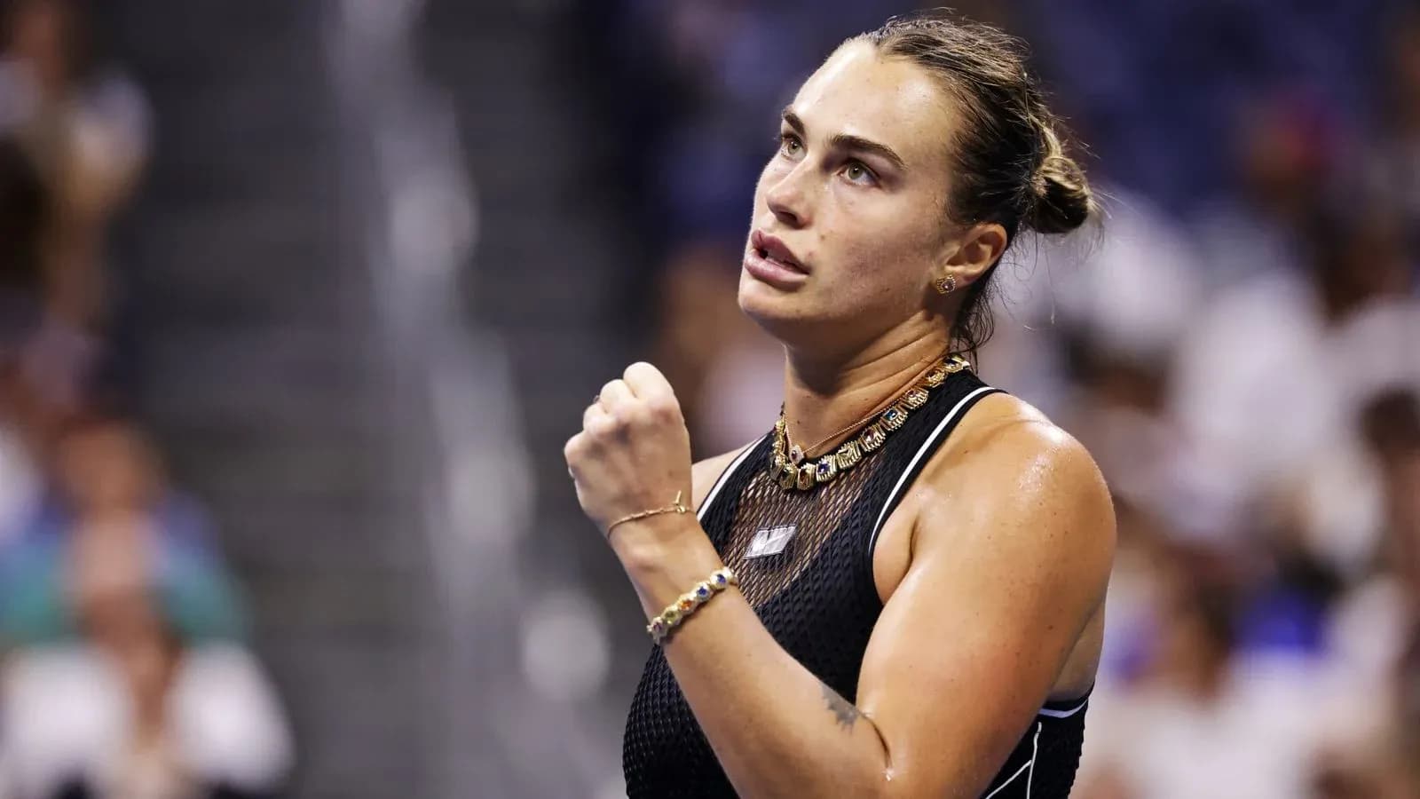 Tennis player celebrating during a match Tennis player celebrating during a match