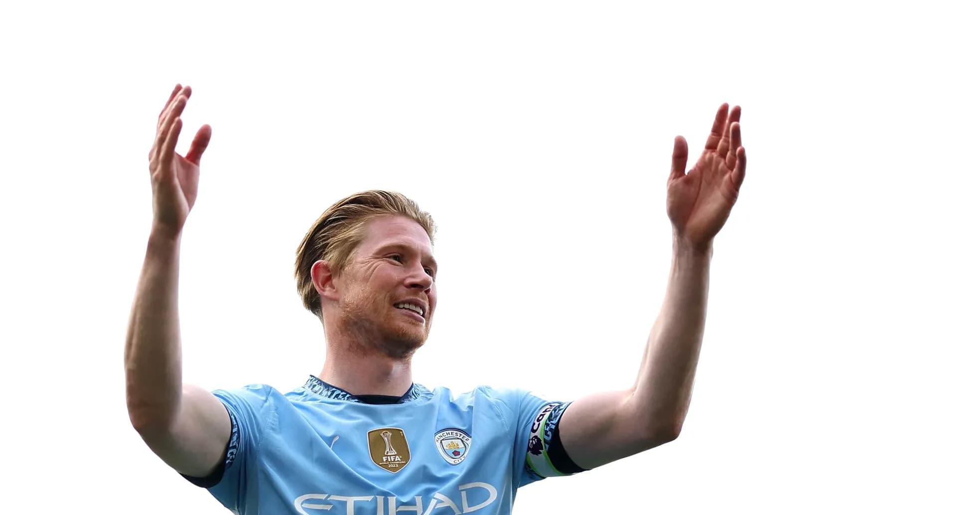 Player celebrating with raised arms on pitch Player celebrating with raised arms on pitch