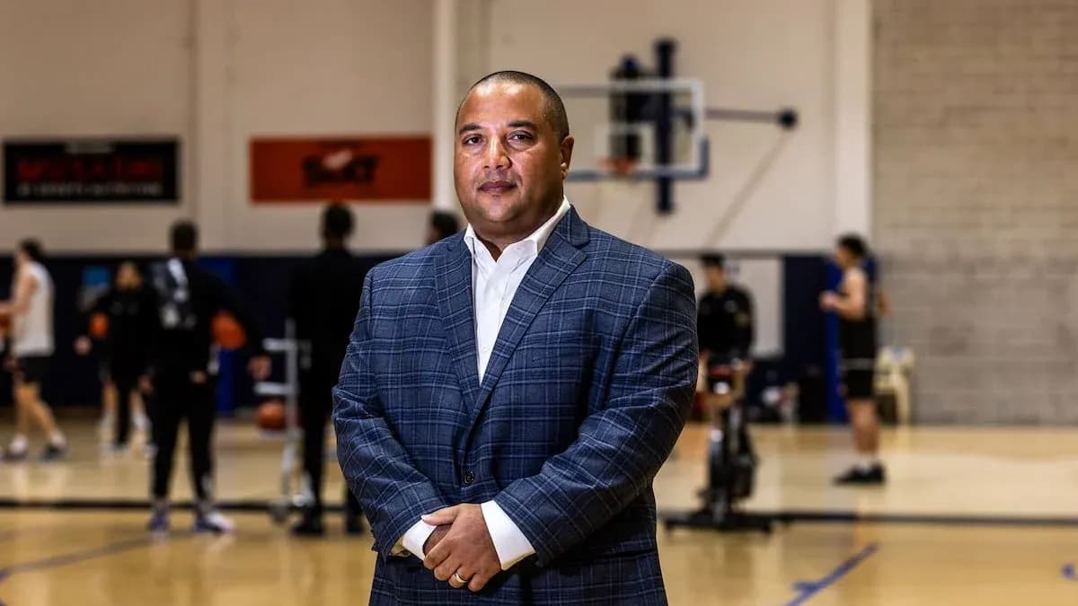 Coach standing in front of basketball practice session Coach standing in front of basketball practice session