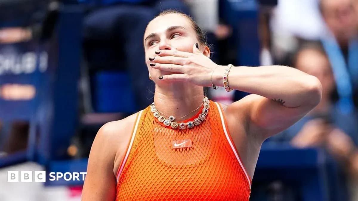 Tennis player celebrating with hand gesture on court Tennis player celebrating with hand gesture on court