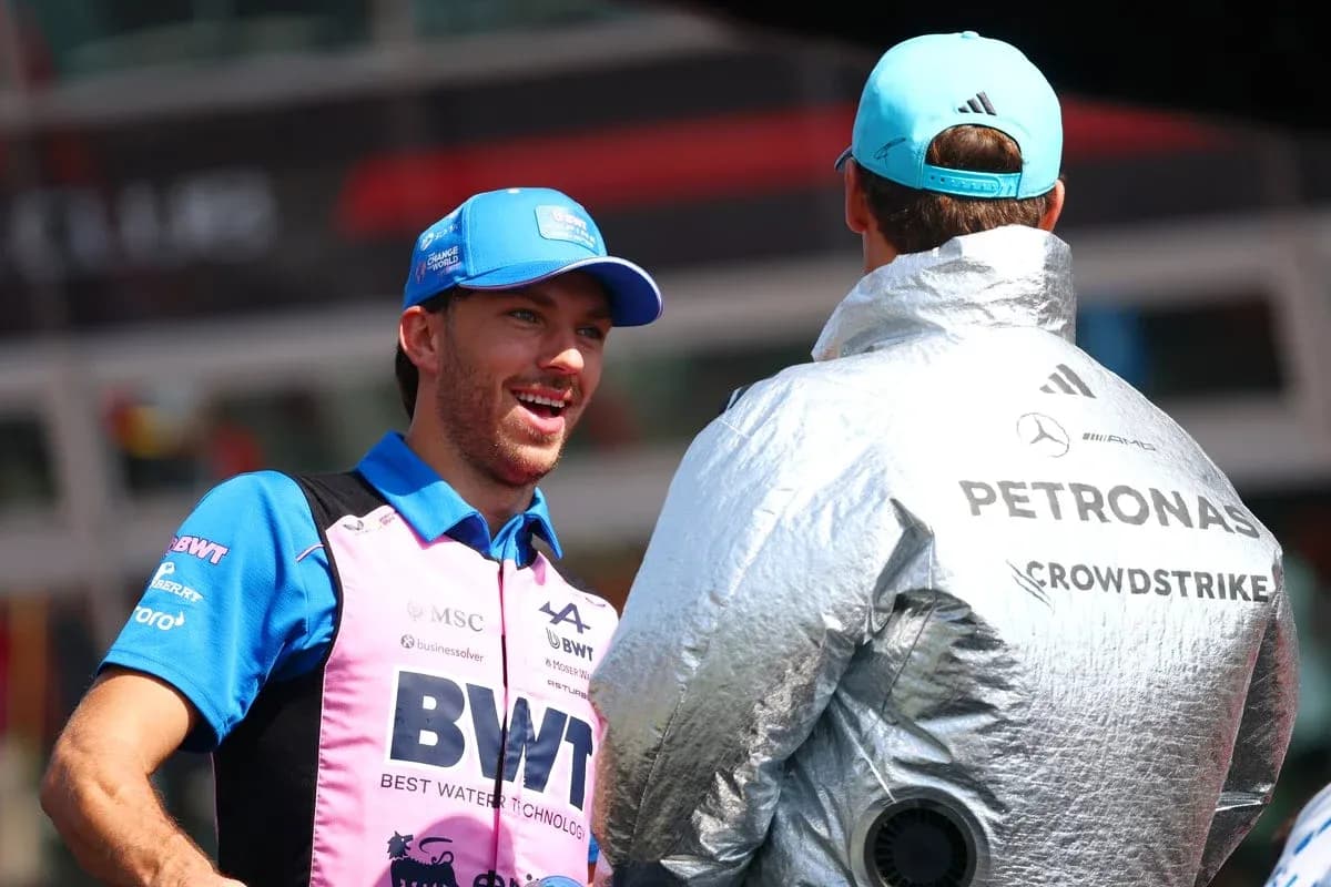 Two drivers chatting in paddock before race Two drivers chatting in paddock before race