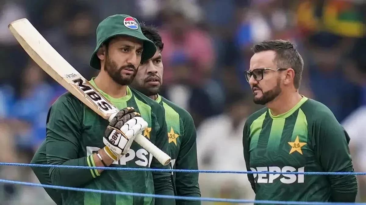 Pakistani cricketers discussing strategy during match Pakistani cricketers discussing strategy during match