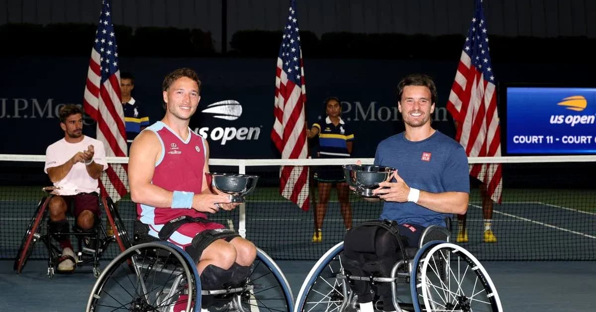 Two wheelchair tennis players holding trophies at US Open Two wheelchair tennis players holding trophies at US Open