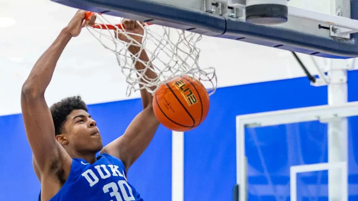 Player dunking a basketball into the hoop Player dunking a basketball into the hoop