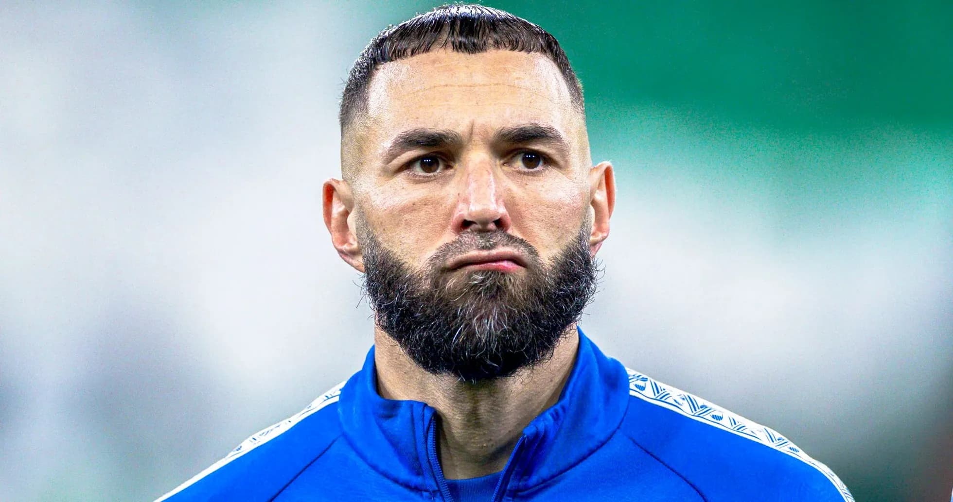 Player in blue training kit during warm-up Player in blue training kit during warm-up