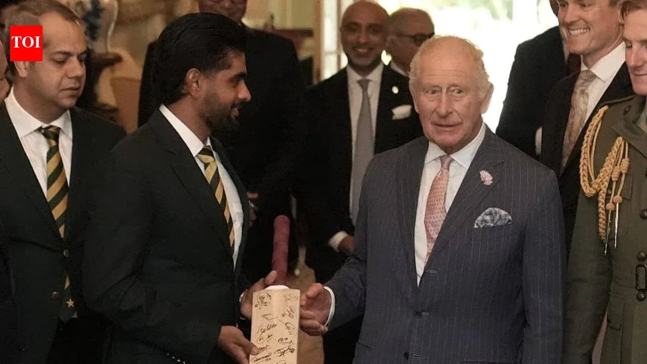 Cricketers presenting signed bat to King Charles Cricketers presenting signed bat to King Charles