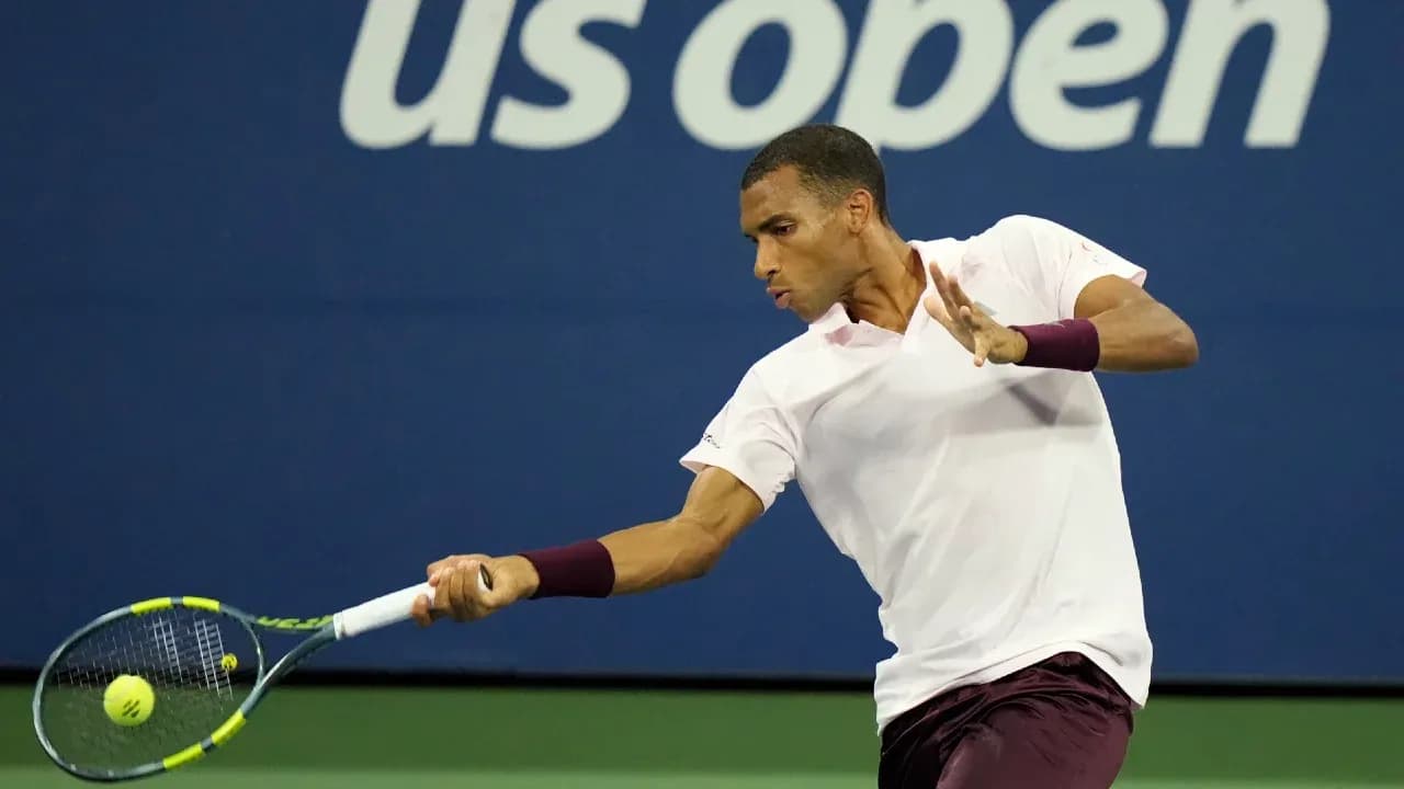 Player hitting a forehand during US Open match Player hitting a forehand during US Open match