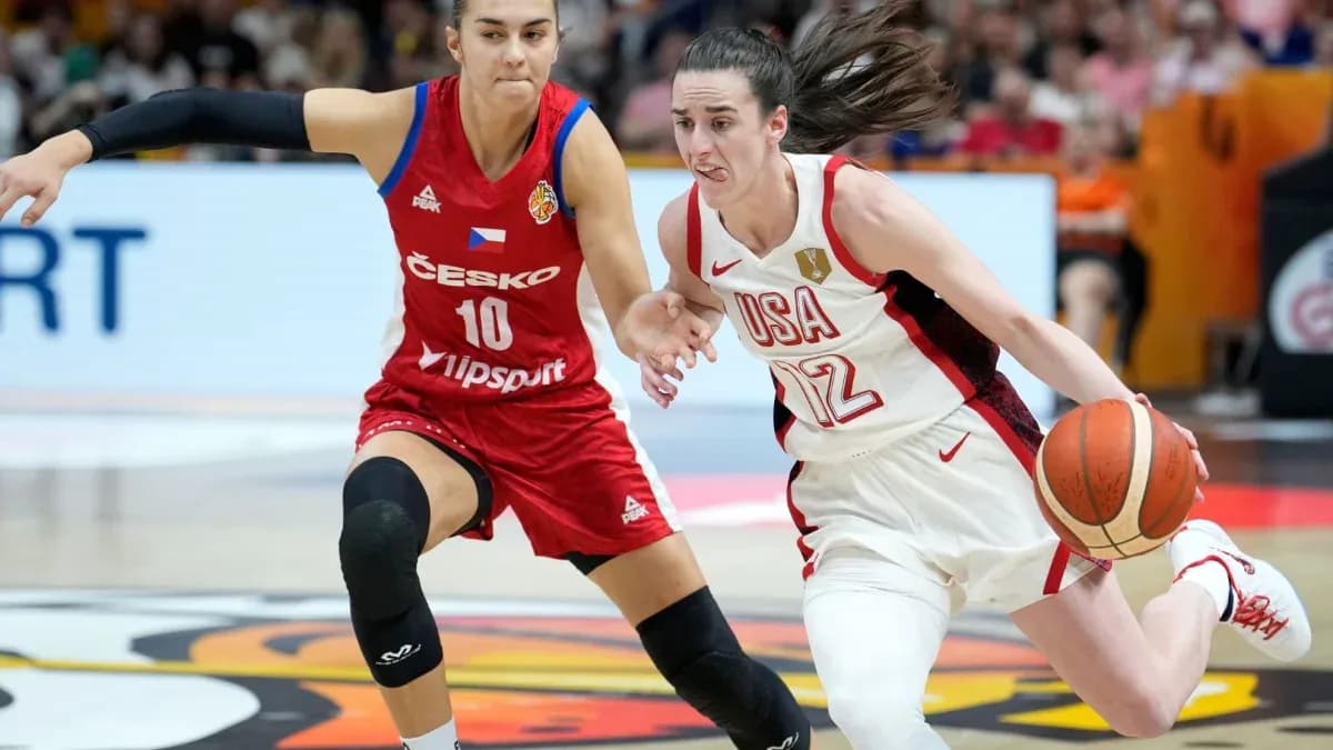 Player from USA dribbling past opponent in red jersey Player from USA dribbling past opponent in red jersey