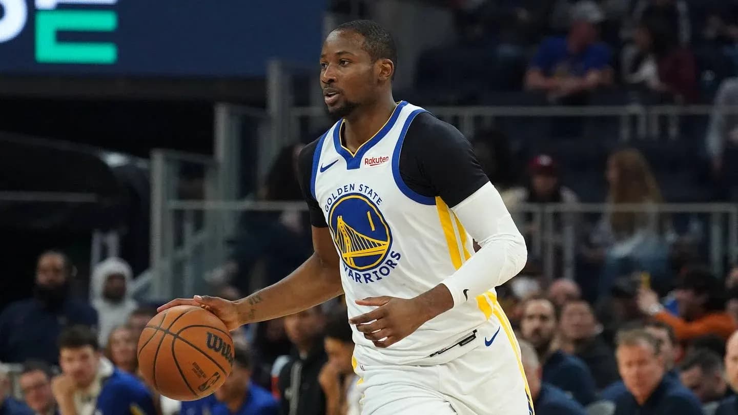 Player dribbling basketball during game for Warriors Player dribbling basketball during game for Warriors