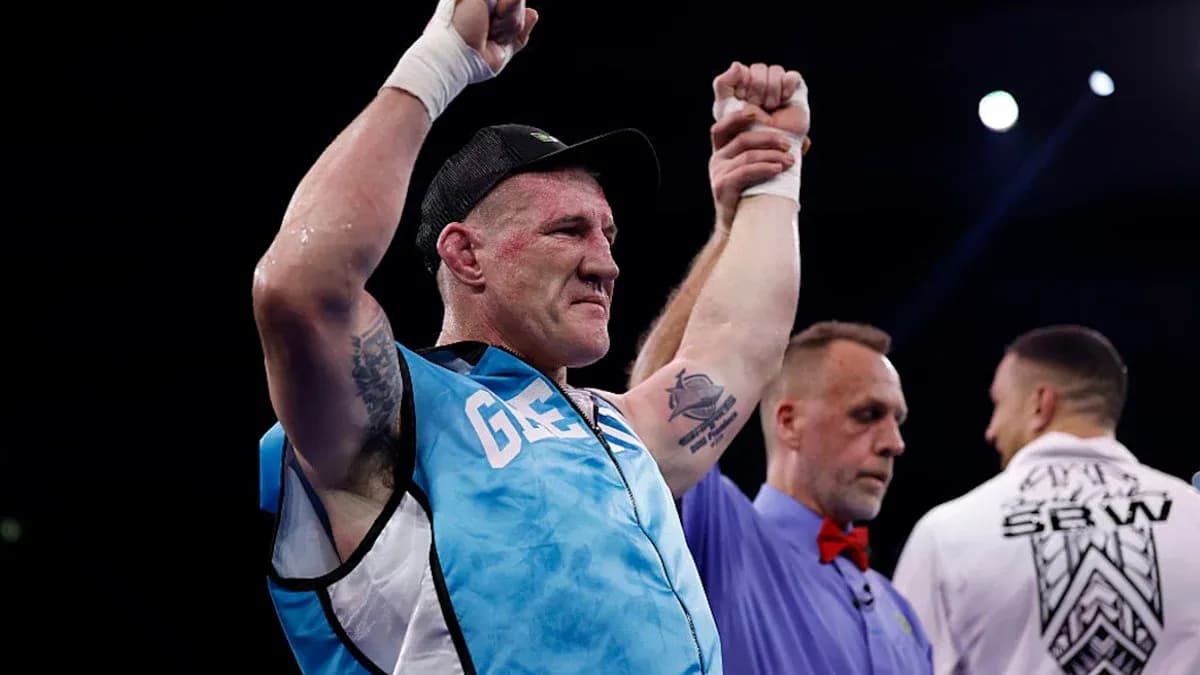 Boxer celebrating victory with raised hands in ring Boxer celebrating victory with raised hands in ring
