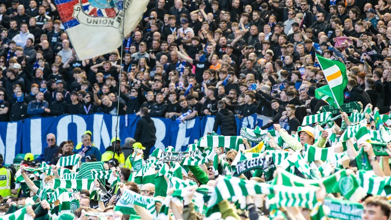 Fans waving scarves in a packed stadium Fans waving scarves in a packed stadium