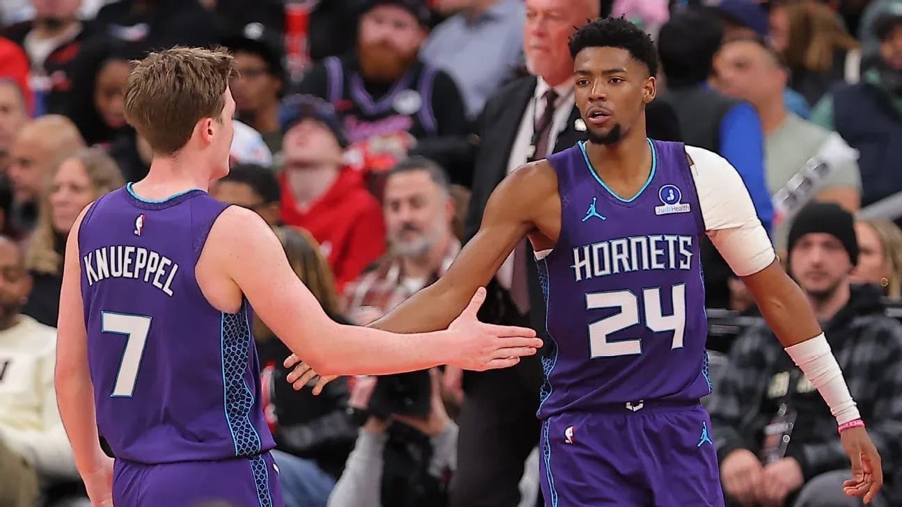 Two Charlotte Hornets players celebrating during game Two Charlotte Hornets players celebrating during game