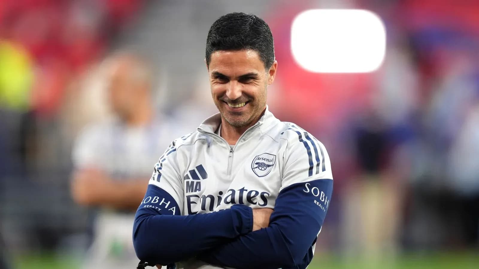 Arsenal manager smiling during a match warm-up Arsenal manager smiling during a match warm-up