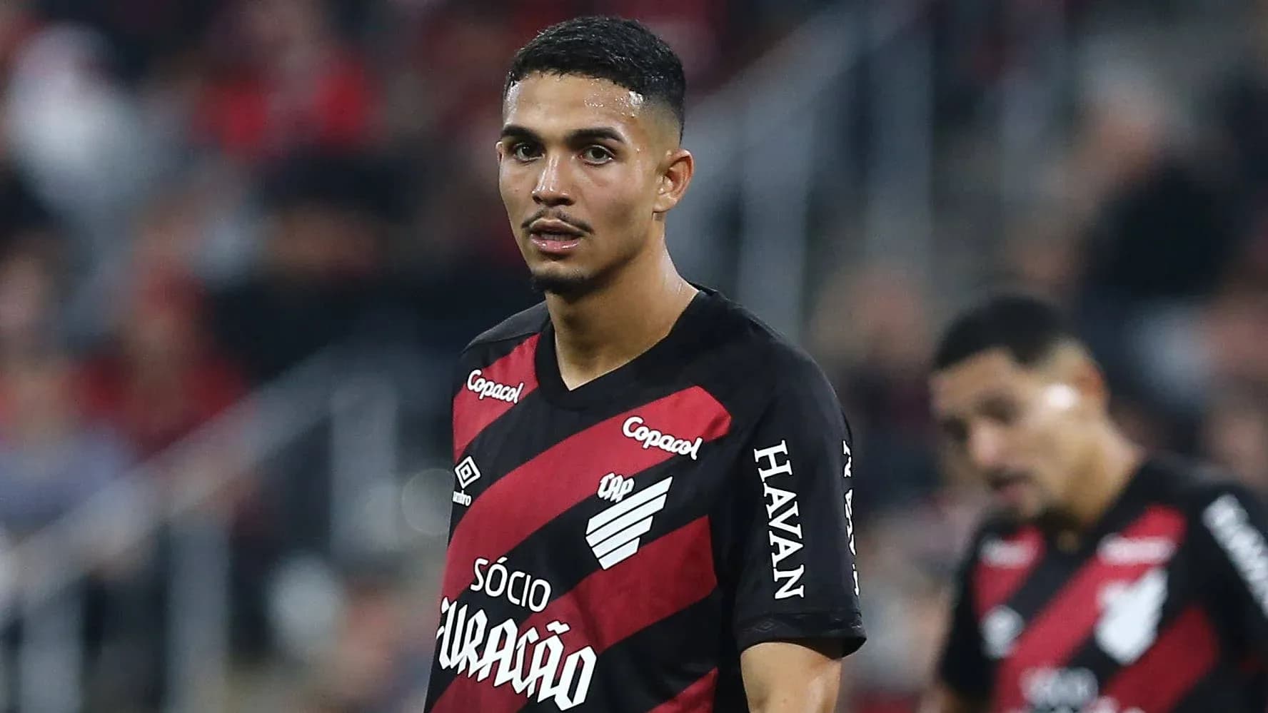 Player in black and red jersey during match Player in black and red jersey during match