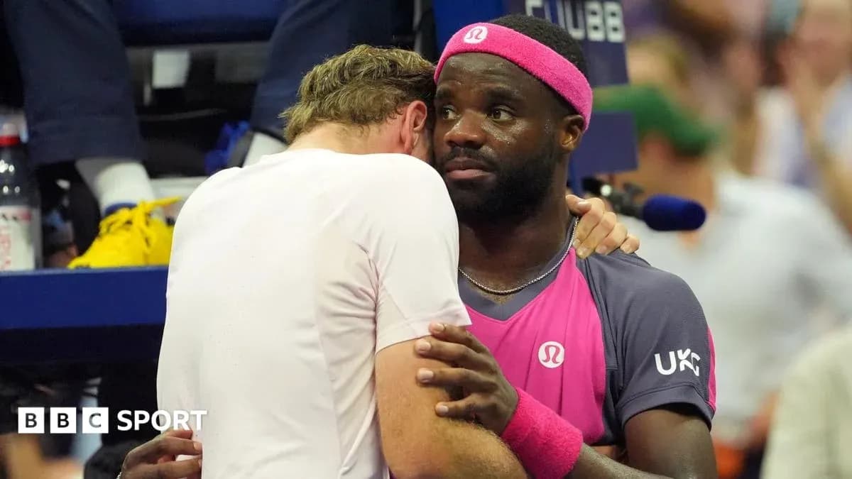 Two tennis players embracing during a match Two tennis players embracing during a match