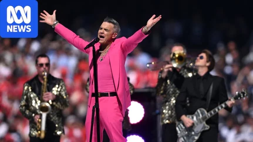 Singer performing in pink outfit with band Singer performing in pink outfit with band