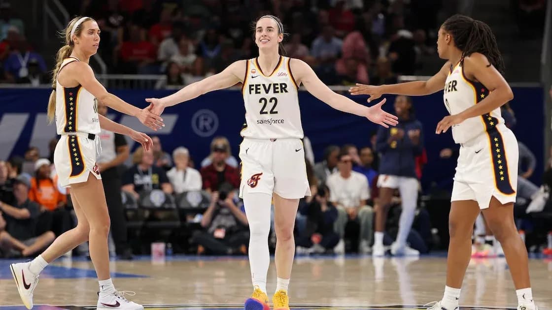 Three players celebrating during a basketball game Three players celebrating during a basketball game
