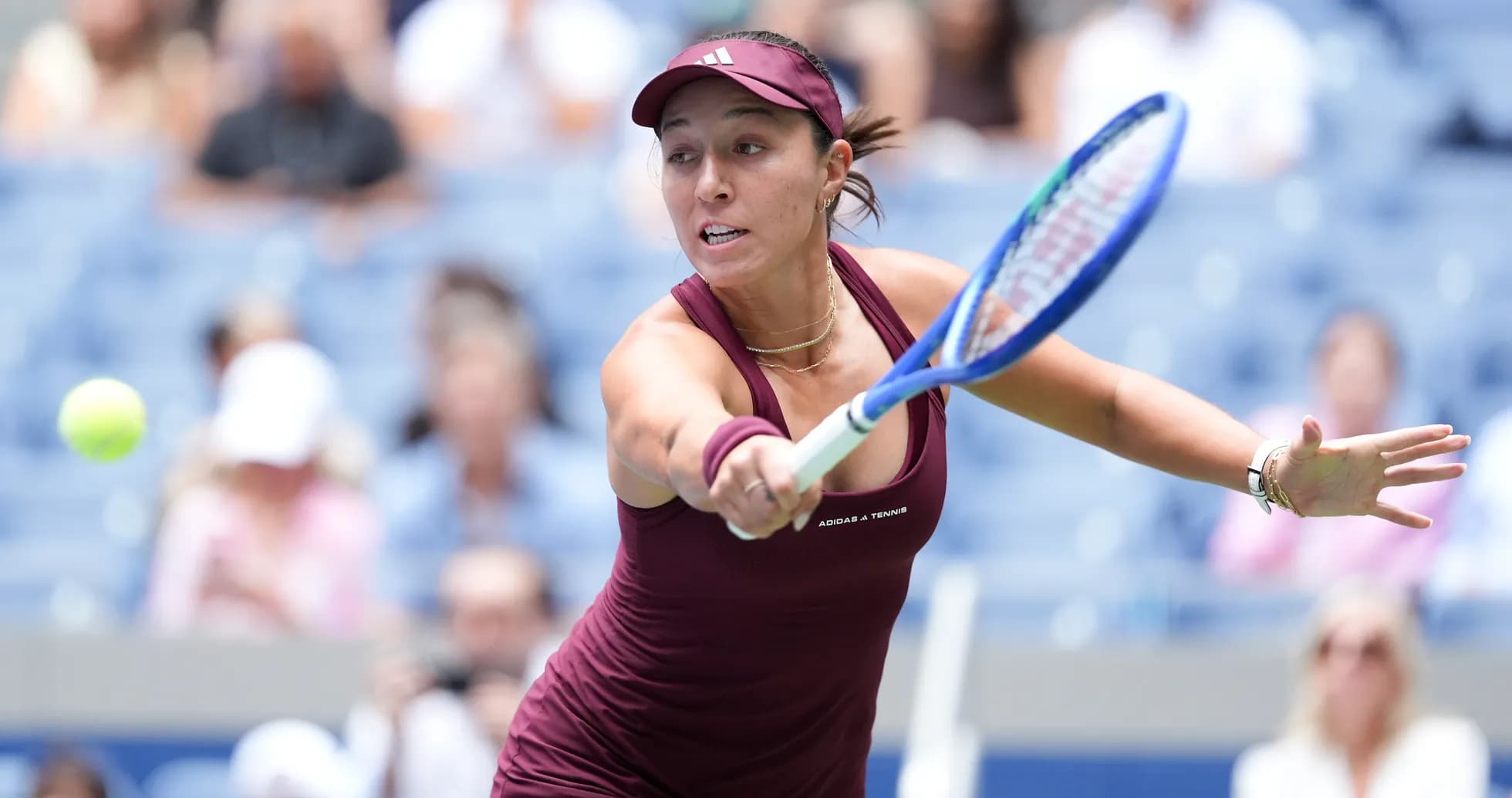 Female tennis player returning a serve on court Female tennis player returning a serve on court