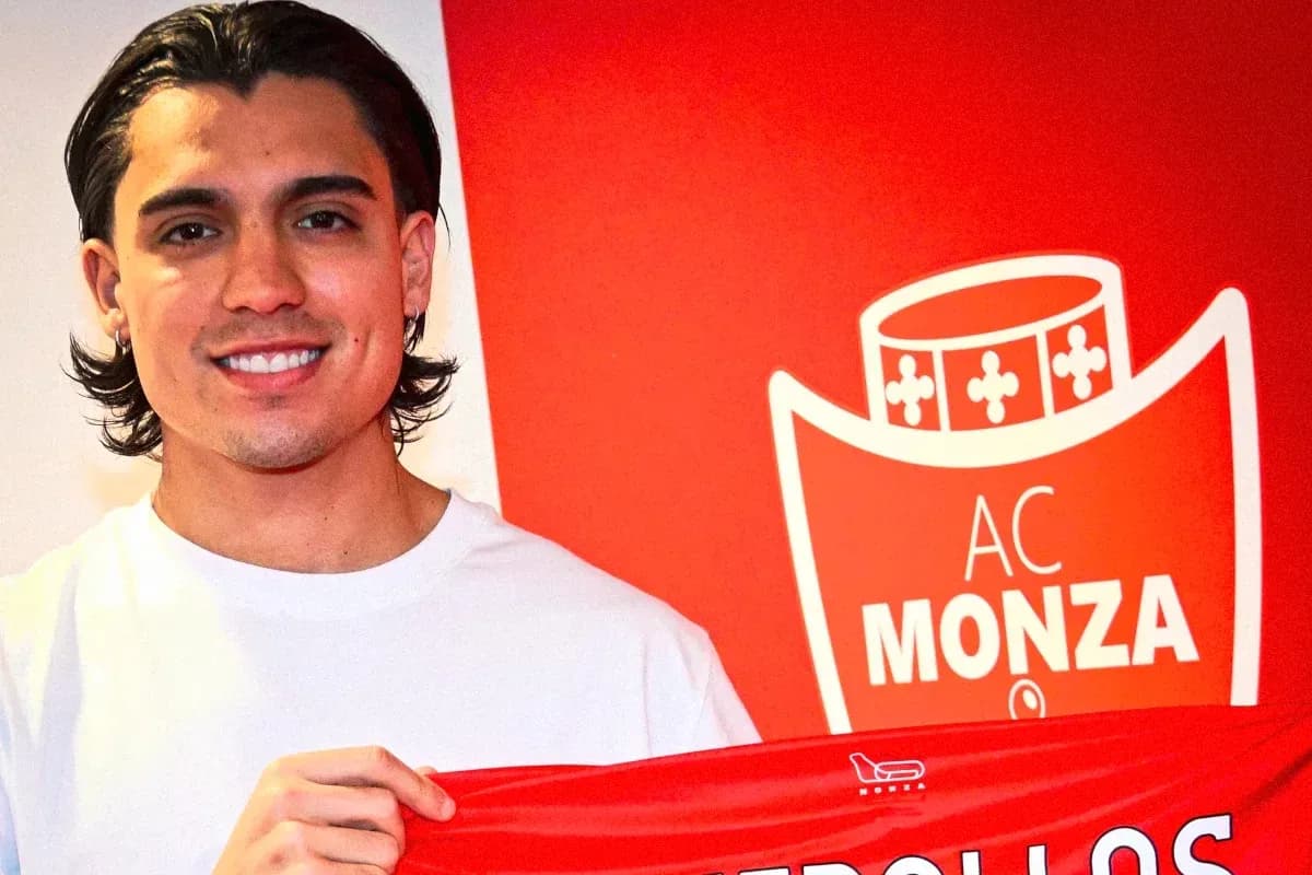 Player holding AC Monza jersey during signing ceremony Player holding AC Monza jersey during signing ceremony