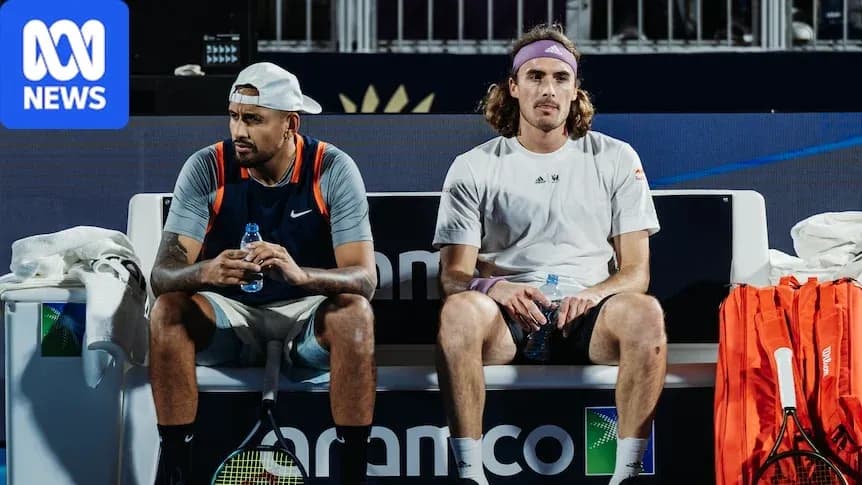 Two tennis players seated on bench during match Two tennis players seated on bench during match