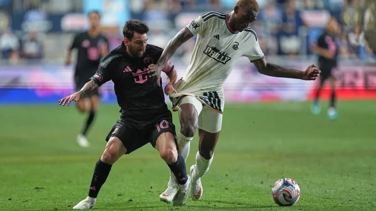 Lionel Messi battling for the ball with opponent Lionel Messi battling for the ball with opponent