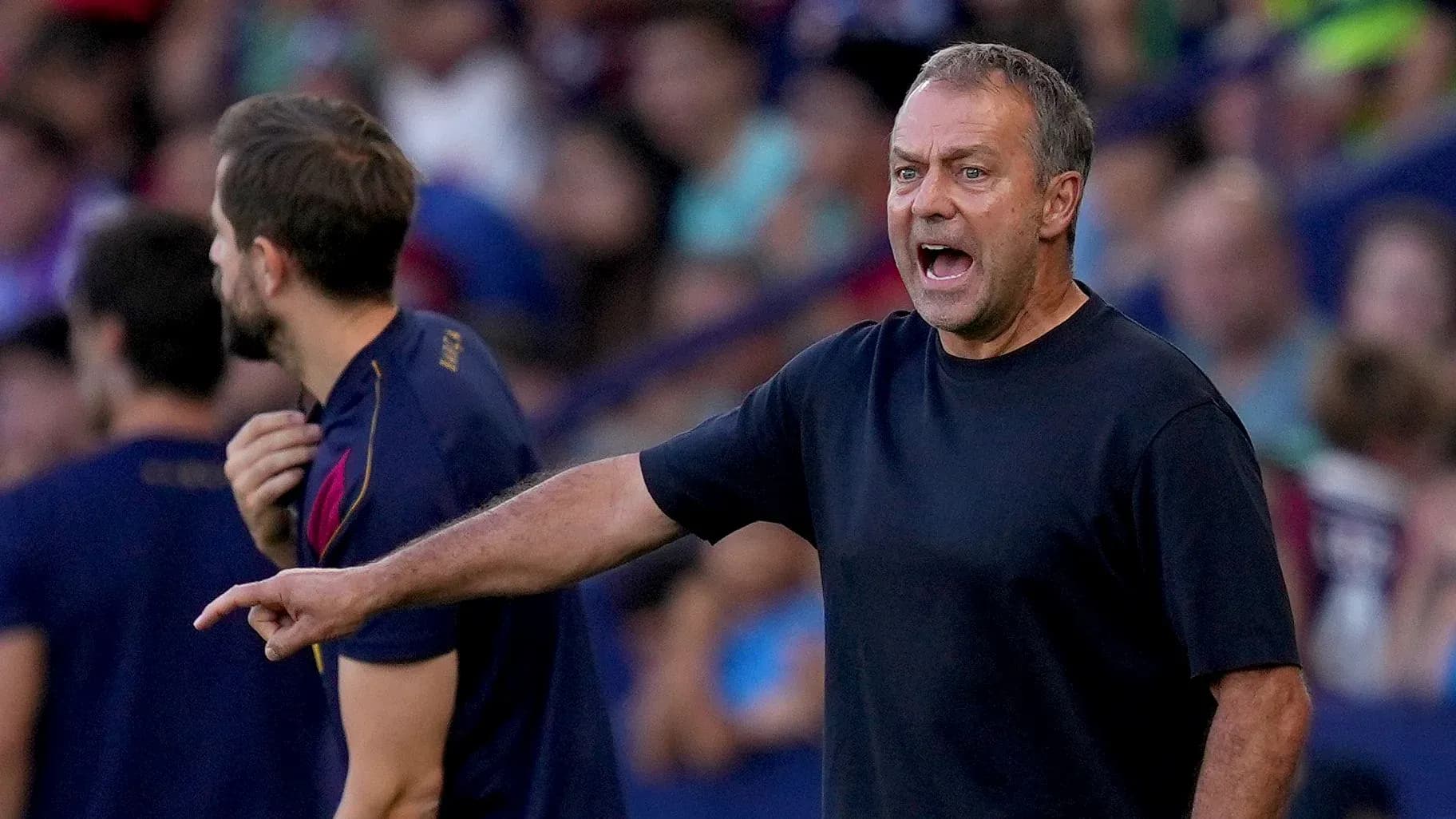 Coach gesturing and shouting during match on sidelines Coach gesturing and shouting during match on sidelines