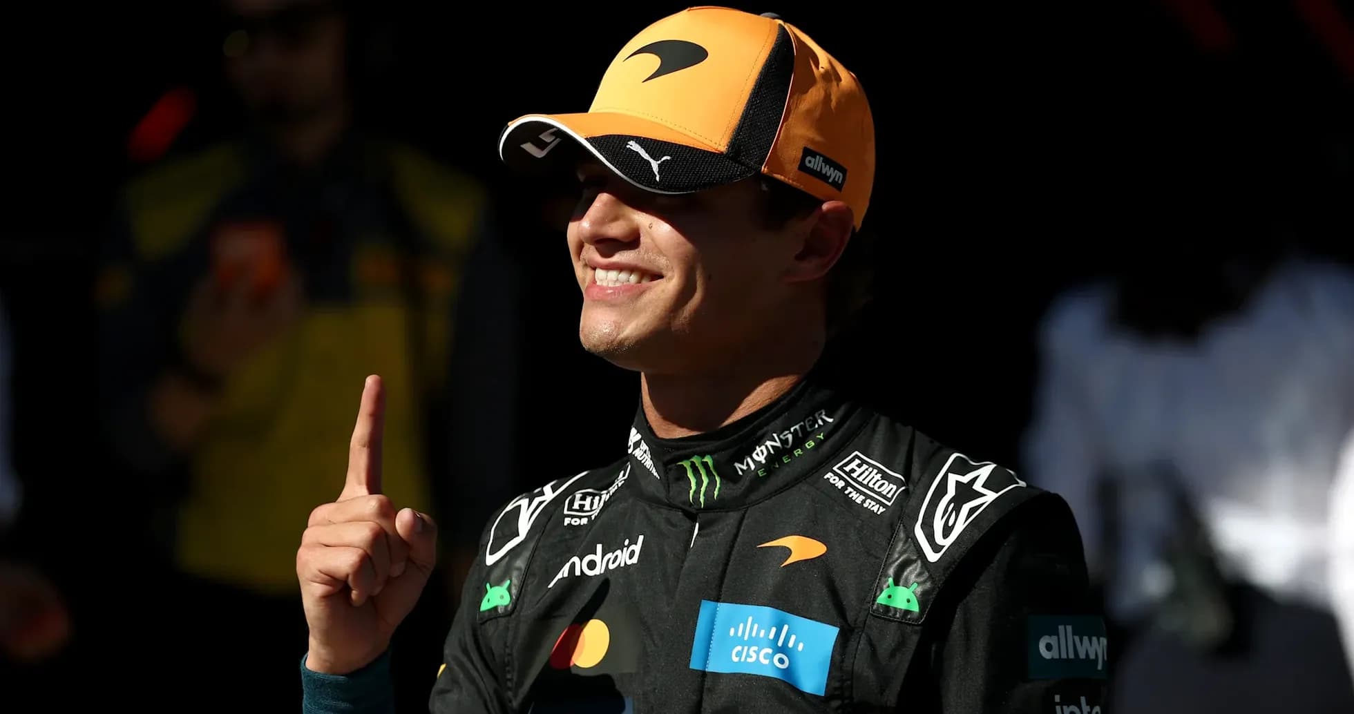 Driver celebrating with a finger raised in the air Driver celebrating with a finger raised in the air