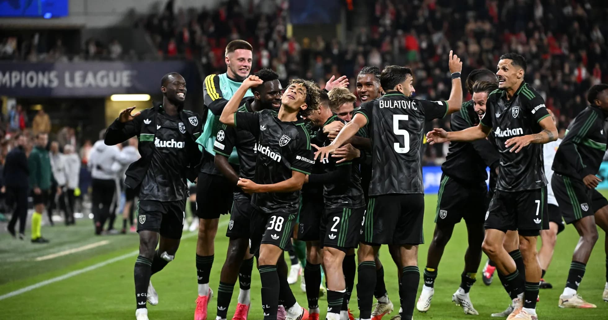 Players celebrating after a goal in Champions League match Players celebrating after a goal in Champions League match