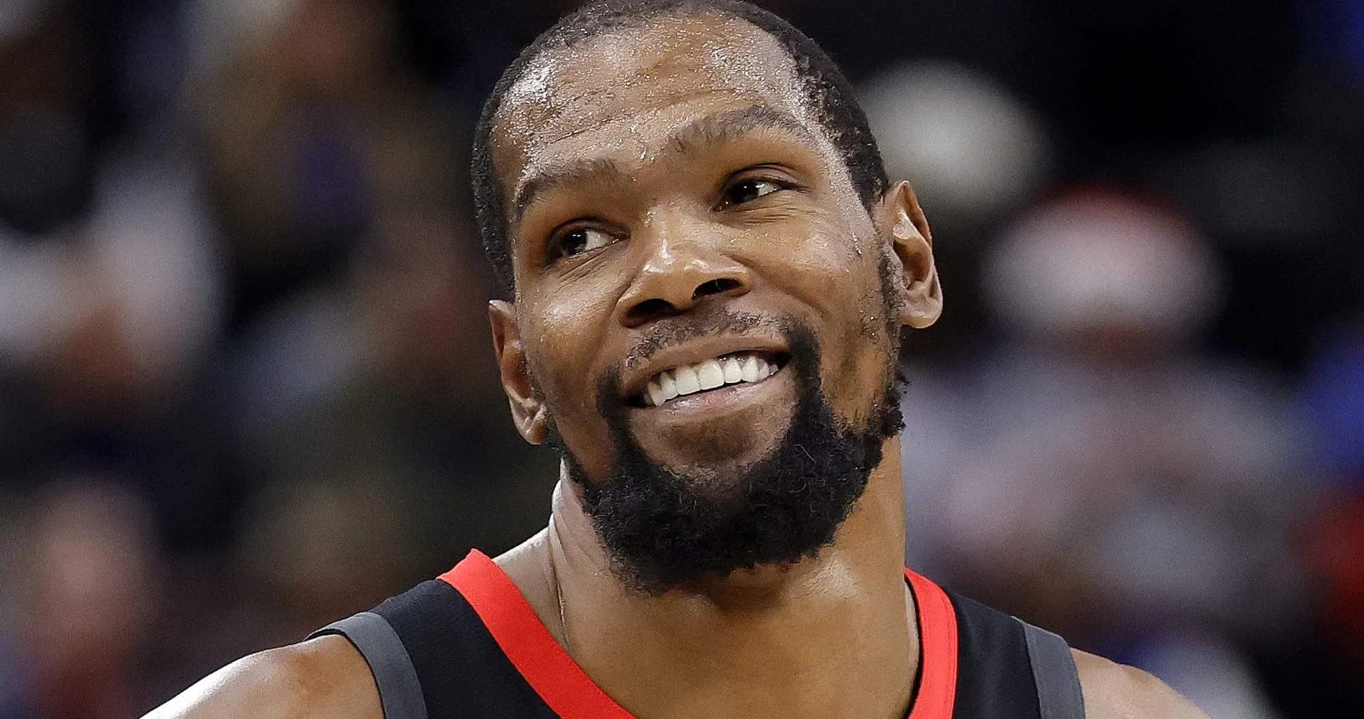 Basketball player smiling during a game Basketball player smiling during a game