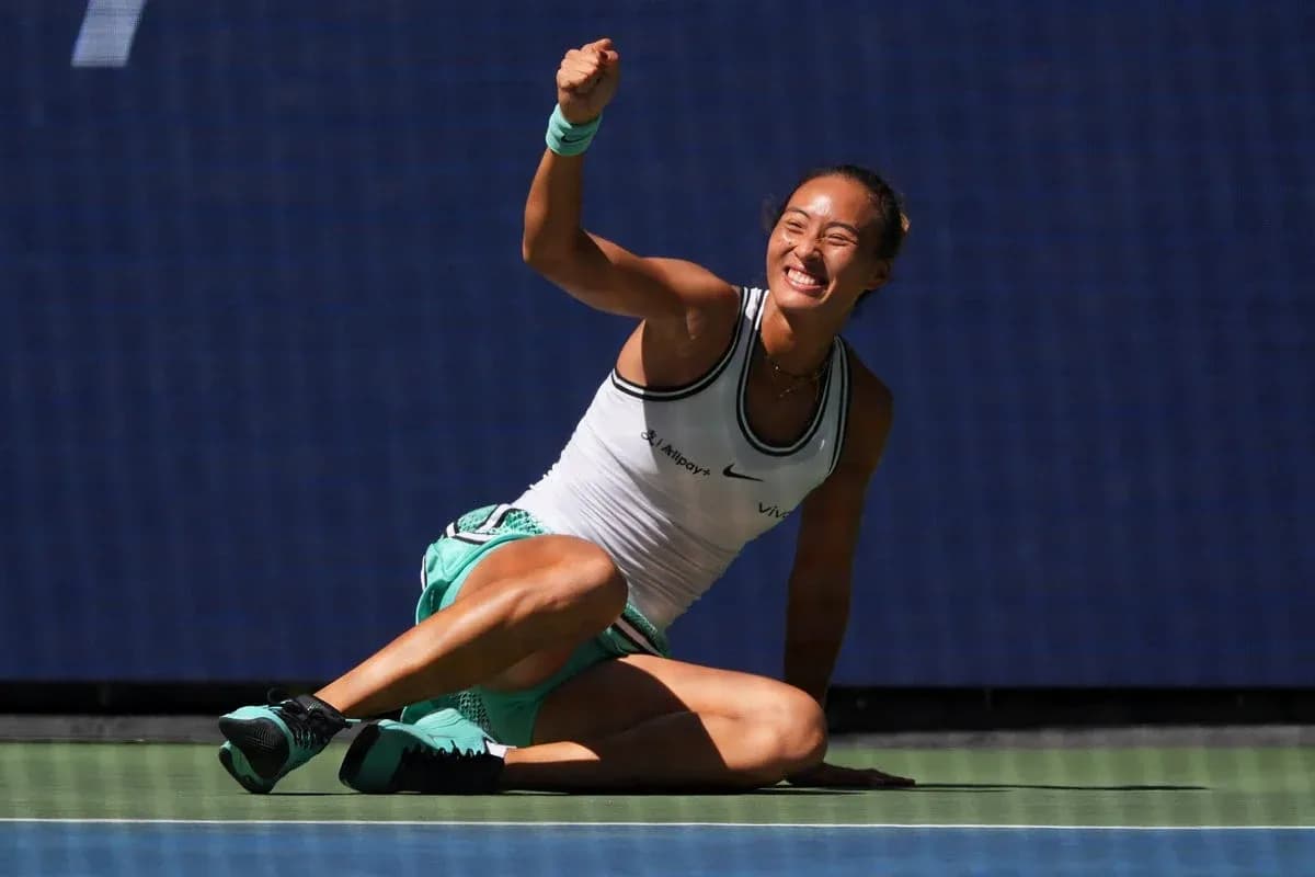 Tennis player celebrating on court after winning point Tennis player celebrating on court after winning point