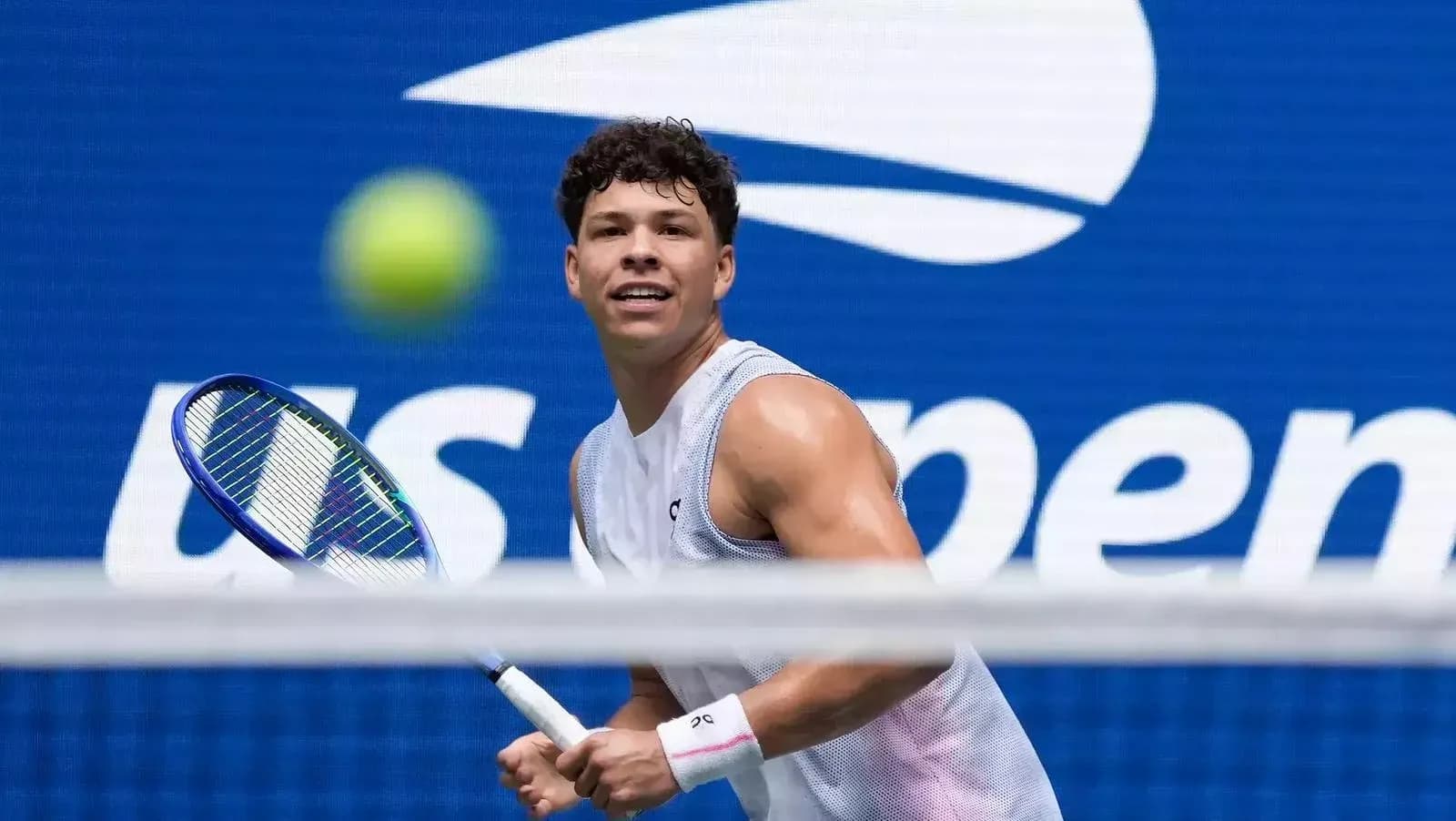 Player preparing to hit a tennis ball at US Open Player preparing to hit a tennis ball at US Open
