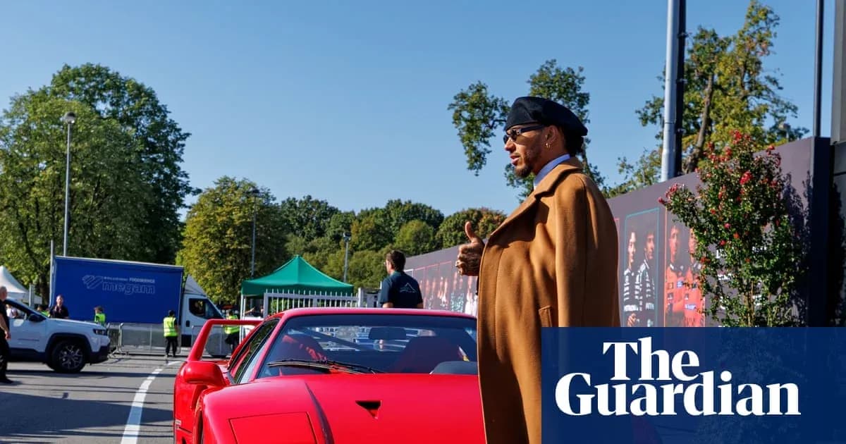 Person standing beside a red sports car outdoors Person standing beside a red sports car outdoors