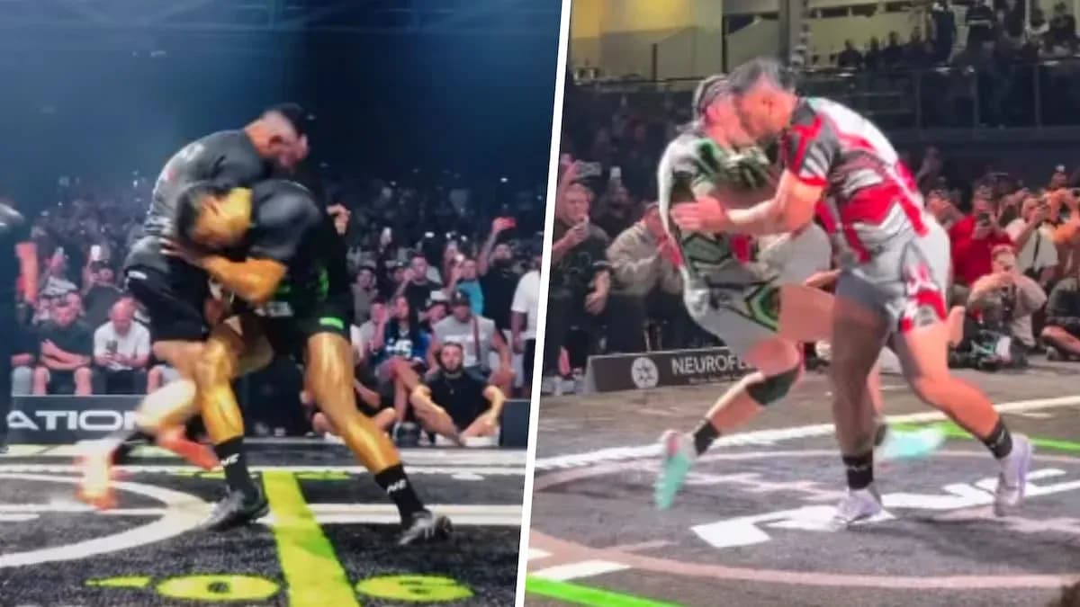 Two wrestlers competing in front of an audience Two wrestlers competing in front of an audience