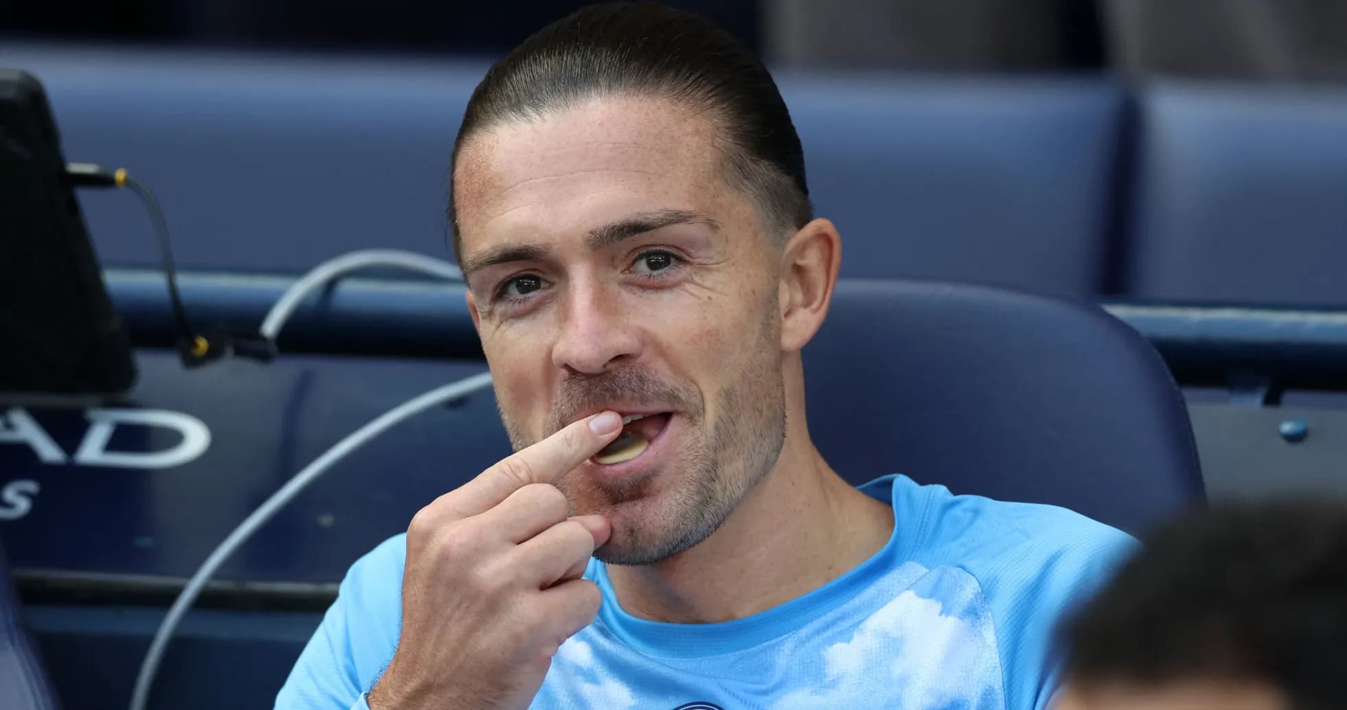 Player sitting on bench, eating during match Player sitting on bench, eating during match