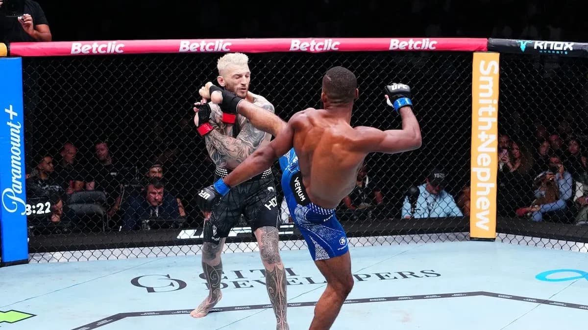 Two fighters engaged in a mixed martial arts match Two fighters engaged in a mixed martial arts match