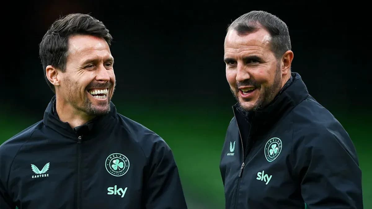 Two coaches smiling during training session Two coaches smiling during training session