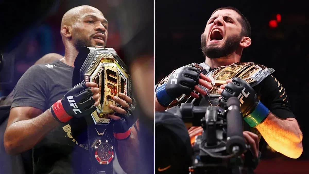 Two UFC champions holding their title belts Two UFC champions holding their title belts